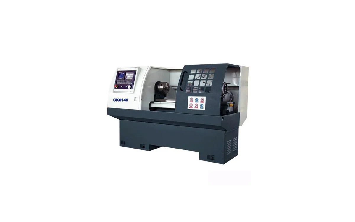 Taikan CK6140 horizontal flat-bed CNC lathe turning a precision steel shaft between chuck and tailstock