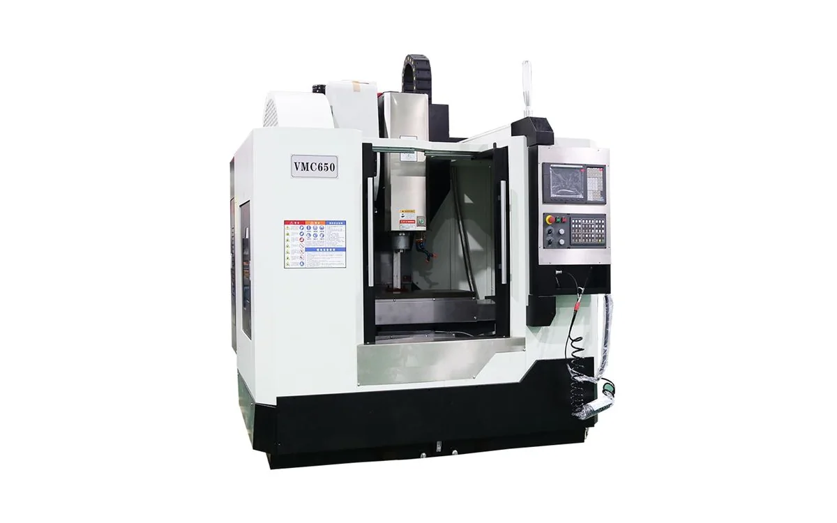 Taikan VMC650 compact 3-axis CNC vertical machining center milling an aerospace aluminum bracket in a precision vise